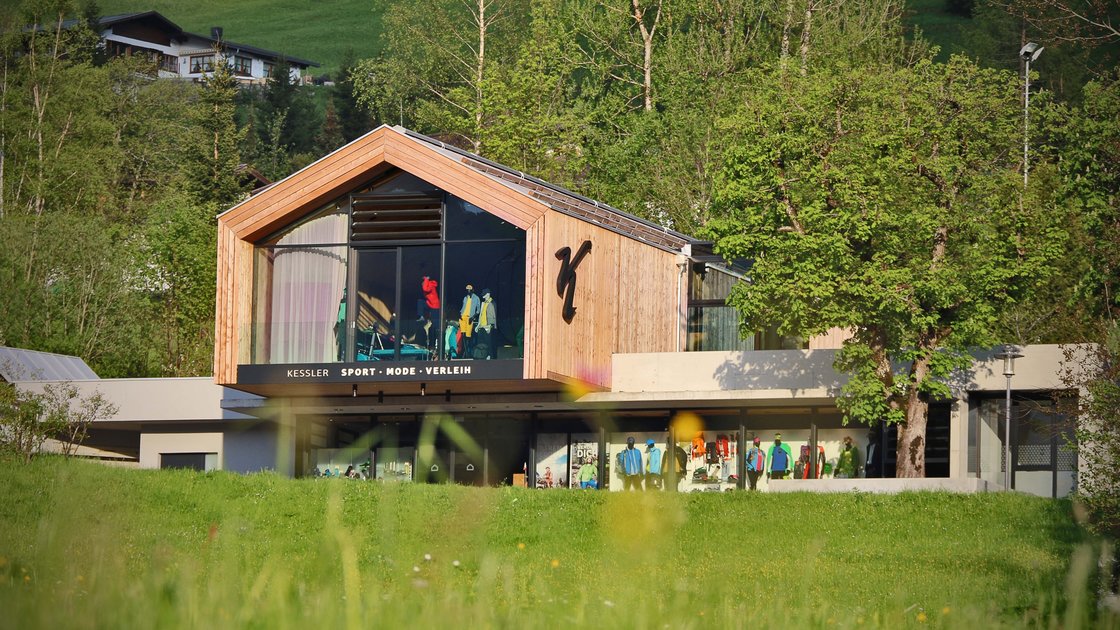 Modern sports shop nestled in a green alpine landscape. © Sport Kessler GmbH